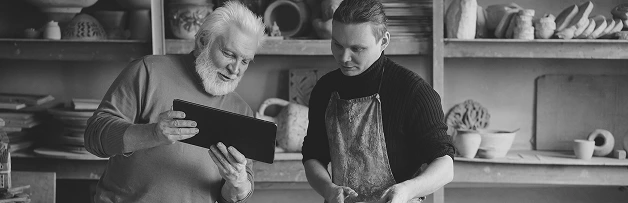 men looking at tablet